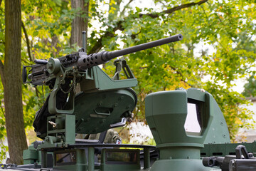 Machine gun on the roof of a modern tank, close-up.
