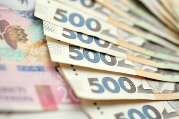 Big amount of different ukrainian hryvnia currency money bills in pile