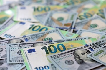 Big pile of Euro and USD banknotes. Many european and united states dollars