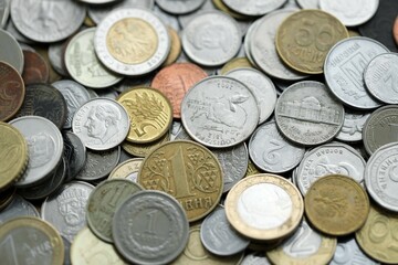 Big pile of different coins from various currencies and different countries around the world. Currency exchange