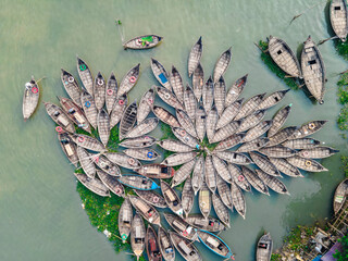 Aerial view of wooden passenger boats along the Buriganga River, Keraniganj, Dhaka, Bangladesh.