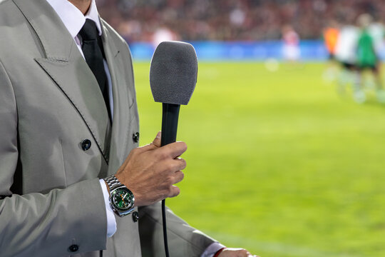 News journalist with microphone interviewing