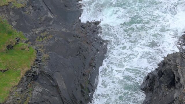 Foamy Waves Crashing On Rugged Rock Of Abereiddi's Blue Lagoon In Pembrokeshire, Wales In United Kingdom. Aerial Shot