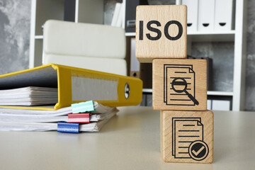 Blocks symbolizing ISO certification. Representing quality standards.