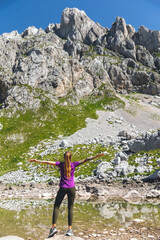 Female Hiking in Mountains Relaxing during Break