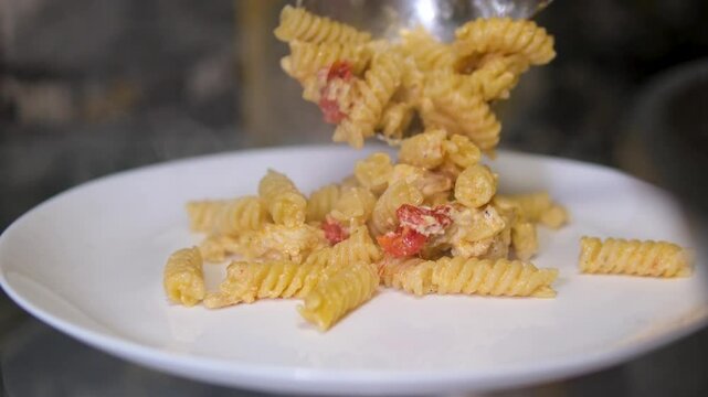 Spiral pasta pieces ready to be cooked close-up slow. Girandole corkscrew shaped pasta Italian food on table 