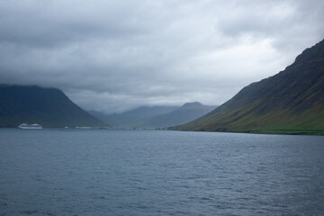 Iceland mountain at the shore with clouds