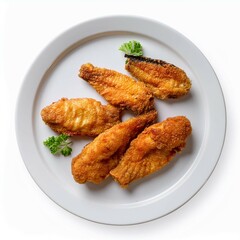 Fototapeta premium Fish fry on white plate on white background top view