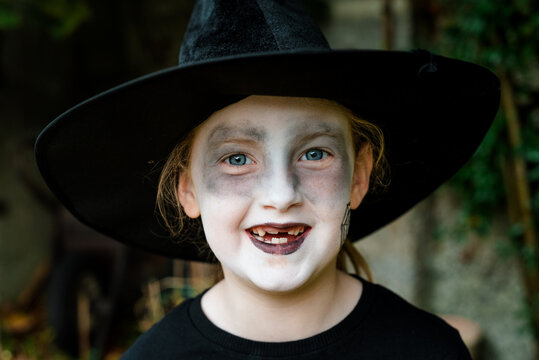 Portrait of a 6 Year Old Girl in a Cute Witch Halloween Costume
