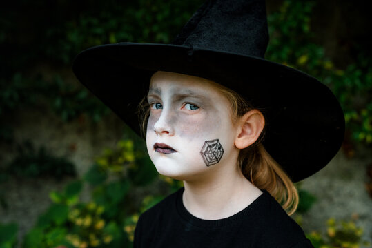 Portrait of a 6 Year Old Girl in a Cute Witch Halloween Costume