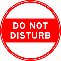 Red color round seal sticker in word do not disturb on white background