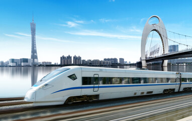 High-speed rail speeds on Bridges and the modern city skyline of guangzhou, China
