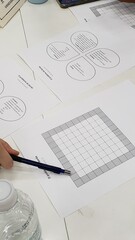 Various math activities on the table, some notebooks and markers