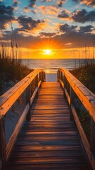 Fototapeta premium A wooden boardwalk leading to the beach, sunset, yellow and orange tones, golden hour