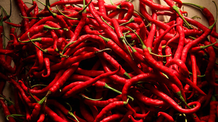 Fototapeta premium Red chili or Capsicum annum L. the shape and pattern of fresh red chilies that fill the screen, red chilies are a plant that is widely cultivated because of its high price