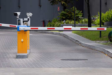 car park barrier with recoding CCTV camera, automatic entry system.