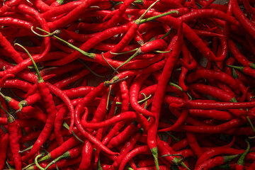 Red chili or Capsicum annum L. the shape and pattern of fresh red chilies that fill the screen, red chilies are a plant that is widely cultivated because of its high price
