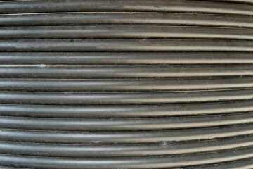 A black wire with a lot of ridges and grooves