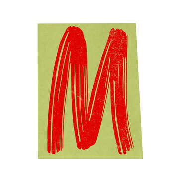 Red letter m on yellow paper tear