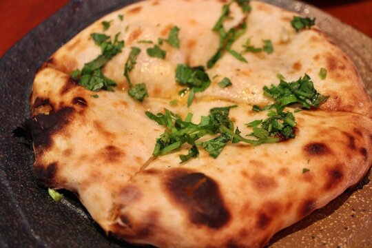 Indian cuisine: keema kulcha (disc-shaped bread)