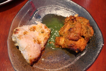 Indian cuisine: tandoori chicken (spiced and roasted chicken)