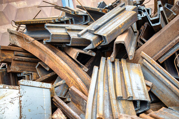 Metal scraps accumulate in a recycling area at the manufacturing plant showcasing the remnants of industrial production processes