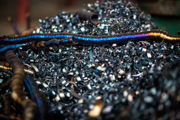 Metal filings collected from machining processes await recycling in a production facility,...