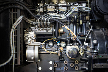 Fototapeta premium Detailed view of a modern pumping station engine highlighting various components and intricate tubing at a utility facility