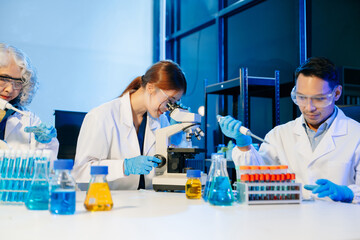 Scientist team meeting and writing analysis results in the laboratory study