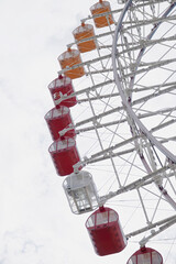 Ferris wheel on sky background, view from below
