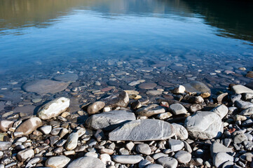 Stones on the shore of a mountain lake