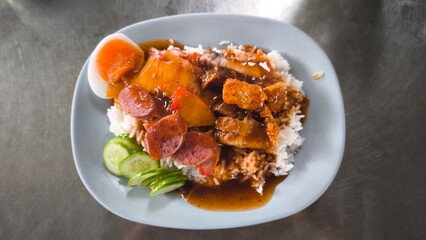 Red pork and crispy pork on rice, food in Thailand.