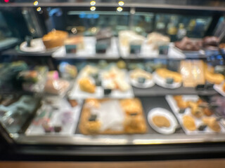  Blurred Bakery Display Case with Assorted Pastries