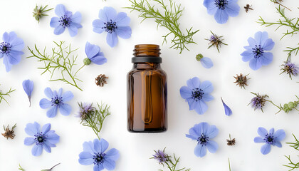 A bottle of Nigella sativa (black caraway oil) surrounded by its blooming blue flowers on a white background, representing medicinal herbs and holistic healing