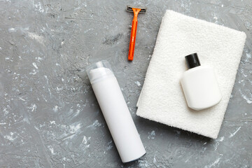 shaving man set. shaving machine, towel, lotion and shaving foam on colored background. Men bath Accessories top view