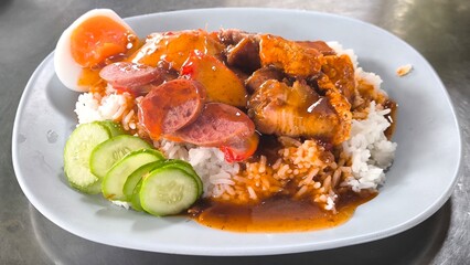 Red pork and crispy pork on rice, food in Thailand.