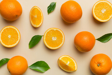 Fruit pattern of fresh orange slices on colored background. Top view. Copy Space. creative summer concept. Half of citrus in minimal flat lay