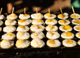 fried eggs in butter as a background.