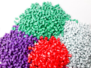 Various colors of masterbatch granules isolated on white background, polymer carriers of color...