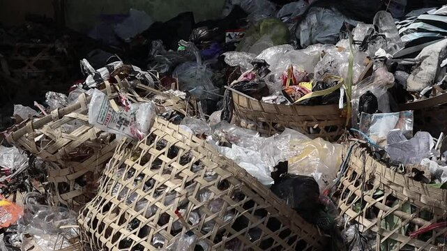 a pile of plastic waste in a sanitary landfill