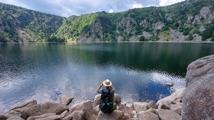 The Photographer take pictures at Lac Blanc in Vosges, France. 