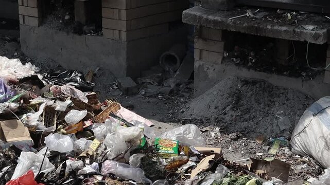 a pile of plastic waste in a sanitary landfill