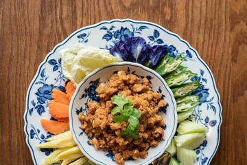 Meat and tomato spicy dip with vegetable and flower. Thai Northern Style food, Nam Prik Ong.