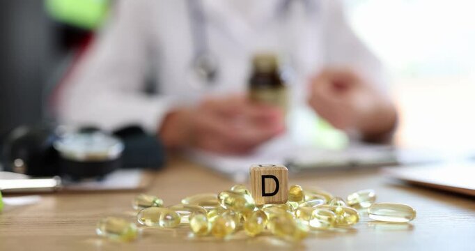 Health care and diet concept doctor dietitian or cardiologist and vitamin d. Fish oil capsules for vitamin d and omega 3 fatty acids