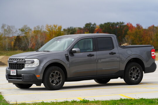 A new grey 2024 Ford Maverick XLT truck sits outside during the fall season.