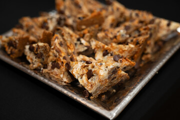 Dessert bars at an event in a plate, close up image of tasty treat at the coffee bar