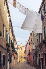 Venice, Italy. Narrow streets of the old town. Drying clothes on lines between houses