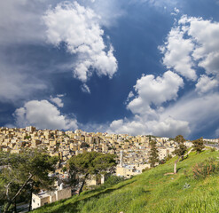 Amman city landmarks-- old roman Citadel Hill, Jordan. Against the background of a beautiful sky with clouds