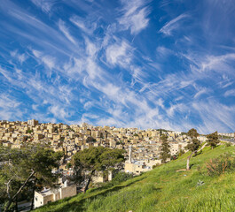 Amman city landmarks-- old roman Citadel Hill, Jordan. Against the background of a beautiful sky with clouds