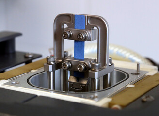 Cracow, Malopolska, Poland - 12.04.2024: A material sample tested in tensile testing machine.